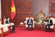 Vietnam, Laos’ fronts and ministries step up cooperation